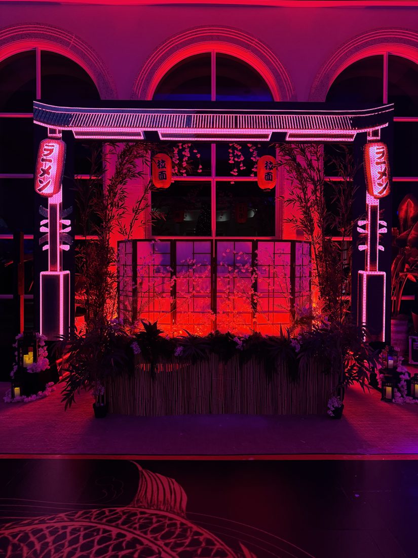 Japanese-themed bar with a neon torii gate and paper lanterns